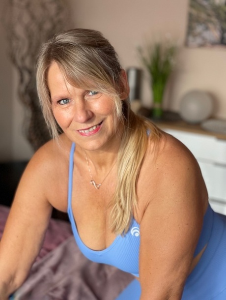 Fit middle-aged woman sports a camel toe before showing her tits and pussy