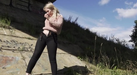 Blonde girl Nastya pulls down her pants for a badly needed pee in the outdoors