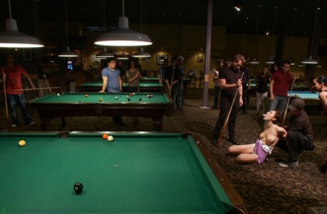 Naked brunette is restrained and penetrated inside a billiard club