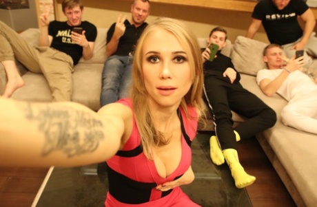 Blonde amateur takes a selfie before being gangbanged in garters and nylons