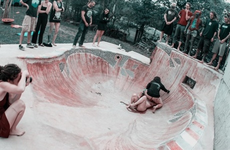 Alternative individuals have sex at a skate park while being pissed on