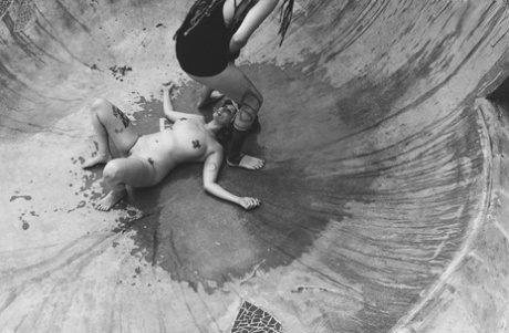 Alternative individuals have sex at a skate park while being pissed on