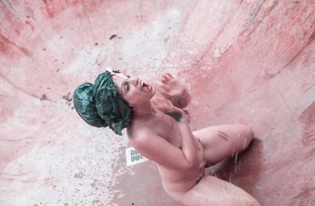 Alternative individuals have sex at a skate park while being pissed on