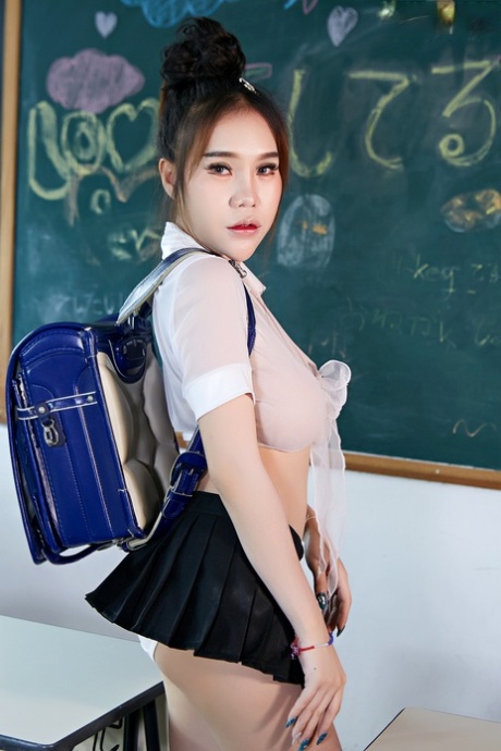 Hot Japanese student Parissa strips to her black boots in a classroom