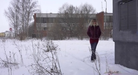 Caucasian girl Jessy shows her bare ass while peeing on snow-covered ground