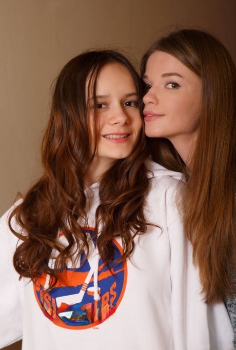 Young lesbians Nedda & Eiby Shine get completely naked on a staircase