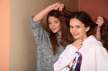 Young lesbians Nedda & Eiby Shine get completely naked on a staircase