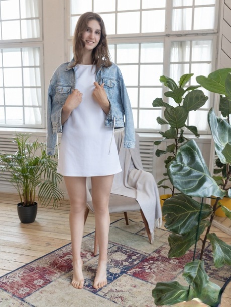 Nice teen Milly removes her clothing for a nude modelling engagement