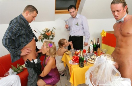 New bride dressed in her wedding dress plays water sport games at reception