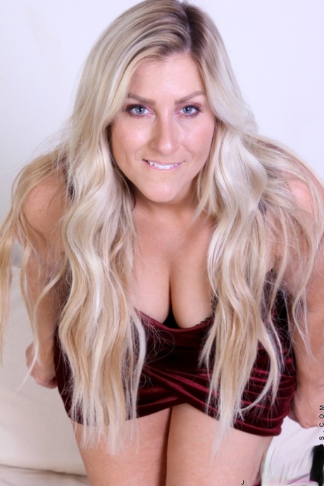 Overweight blonde Jenna Mane removes a red velvet dress before masturbating