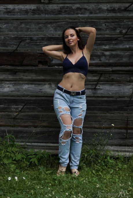 18-year-old Annette Nicole V gets totally naked in front of a rustic building