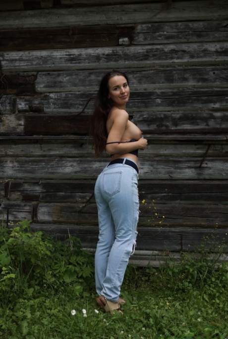 18-year-old Annette Nicole V gets totally naked in front of a rustic building