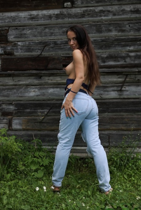 18-year-old Annette Nicole V gets totally naked in front of a rustic building
