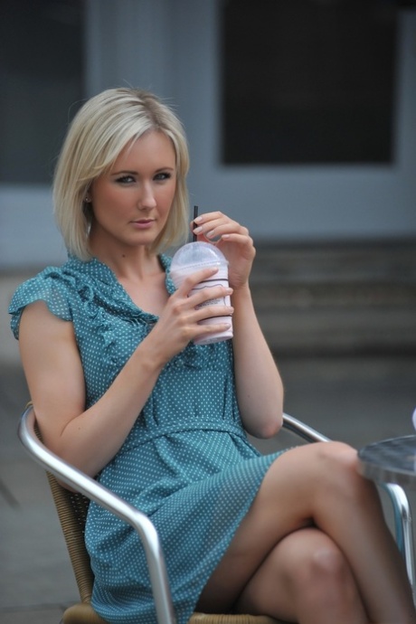 Blonde British girl Sam Tye flashes her upskirt panties before going topless