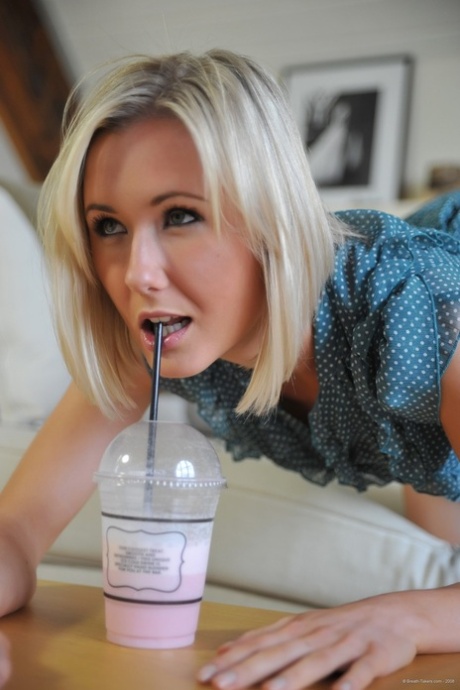 Blonde British girl Sam Tye flashes her upskirt panties before going topless