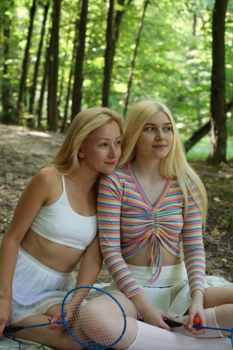 Young girls Sati & Suna get butt naked on a blanket in the woods