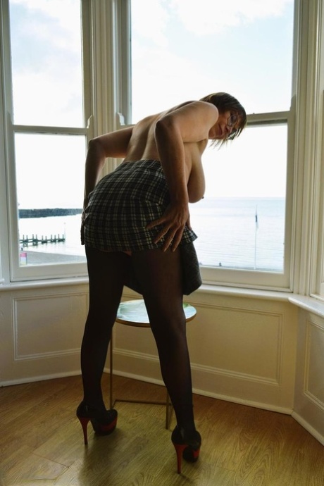 Older British lady Barby Slut shows her big boobs in crotchless pantyhose