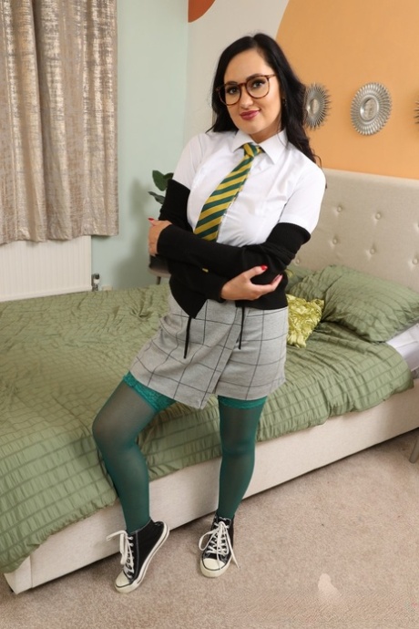 College girl Bonnie unleashes her firm tits while wearing hose over nylons