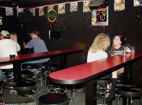 Ginger Klixen engages in lesbian sex inside a dive nightclub