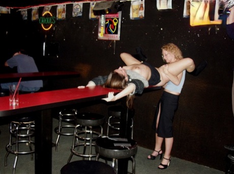 Ginger Klixen engages in lesbian sex inside a dive nightclub