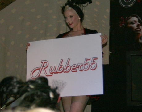 Fire performers in latex enhance the mood at a fetish convention