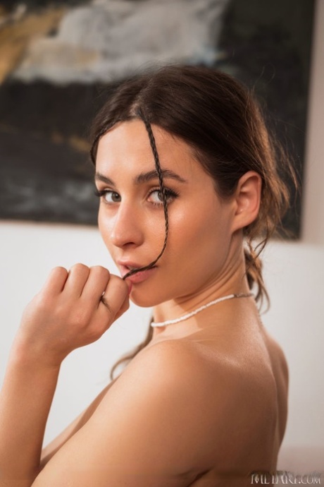 Gorgeous teen Mara Blake strips to her socks while sporting headphones