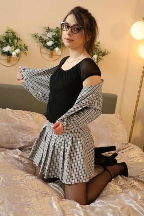 Pretty brunette secretary Gia shows her tiny tits in a garter belt and nylons