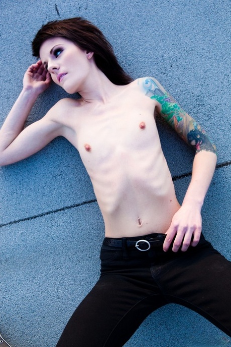 Skinny alt babe with tattooed body exposing tiny tits outdoors on rooftop