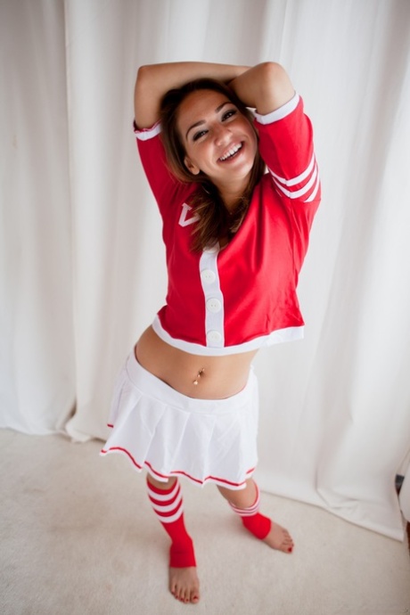 Cute brunette cheerleader flashing young tits and ass in sports socks