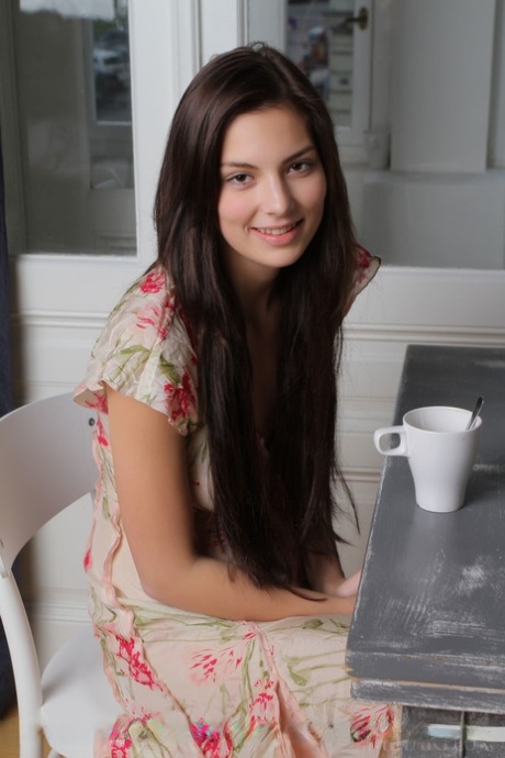 Brunette Euro babe with sexy legs spreading shaved teen pussy