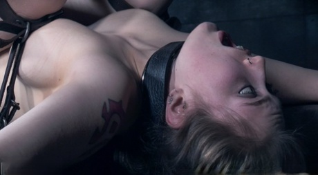 Naked girl Electra Rayne finds herself blindfold while being used as a slave