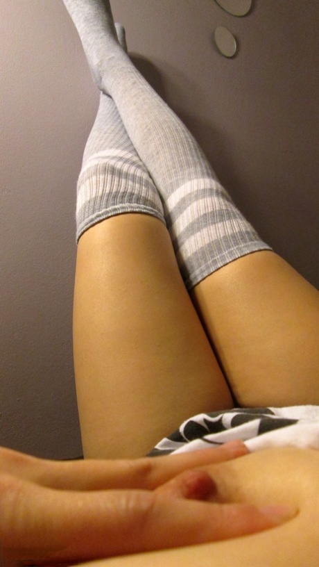 Pierced amateur Sydney Mai in glasses & socks showing cameltoe & nice tits