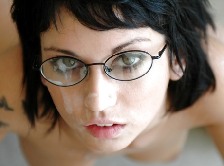 Cute coed in glasses Riley Evans gets her shaved pussy stretched