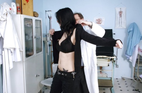 Brunette beauty Roxy Taggart is having her big tits teased by a doctor