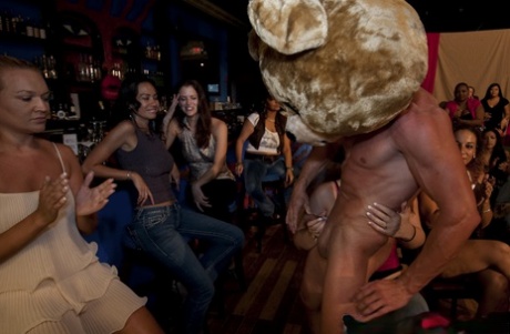 Clothed chicks love cumshot from sexy strippers while doing blowjobs