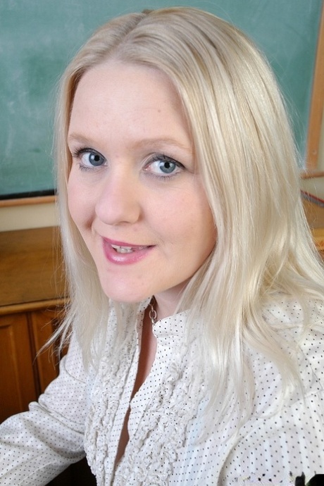 Fatty mature blonde Samantha shows her big boobies in the classroom