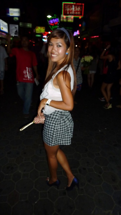Naughty asian babe in mini skirt gives a blowjob and gets pounded