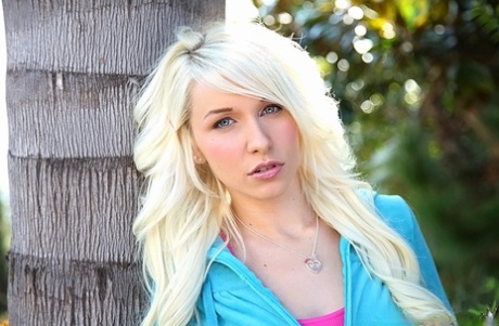 Blonde teen babe Stevie Shae uncovering her fuckable body