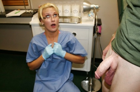 Slutty blonde babe in nurse uniform and glasses jerking off a big cock