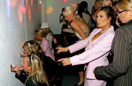 Lustful gals showing off their cock sucking skills at a gloryhole party