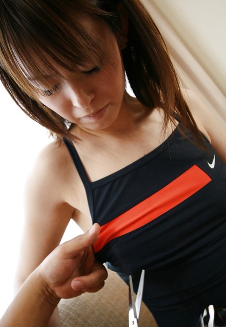 Smiley asian sweetie gets her sport outfit ripped and exposes her titties