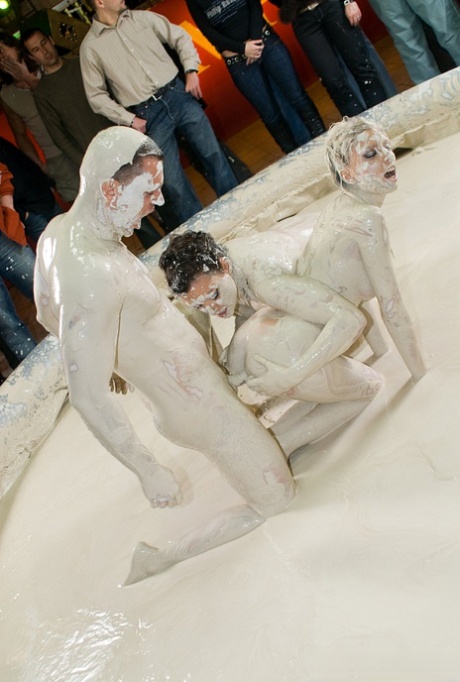 Lesbian MILFs with big breasts having a wild FFM threesome in a mud pool