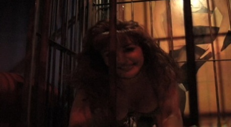 Latina MILF Sexy Vanessa flashes her beautiful big tits in a slave cage