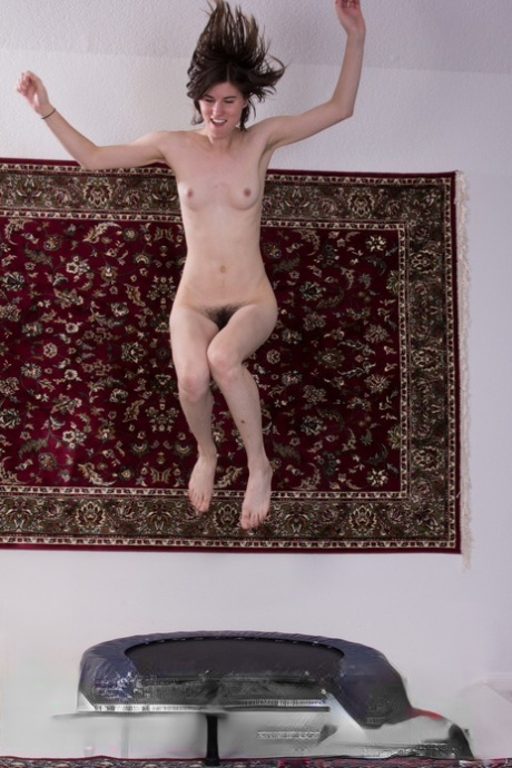 Tall amateur girl Kiyoko shows her small tits and hairy muff on the trampoline