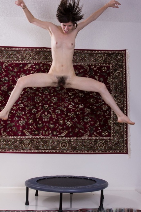 Tall amateur girl Kiyoko shows her small tits and hairy muff on the trampoline