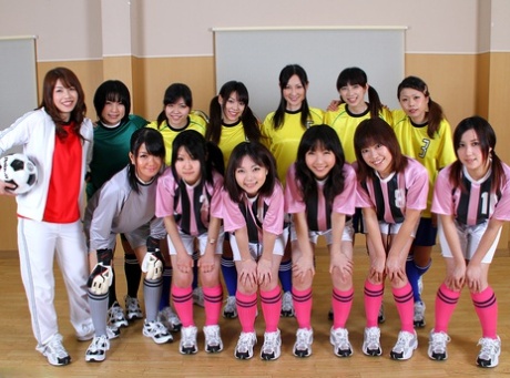 Asian female football team watches as a teammate gets fucked by the referees