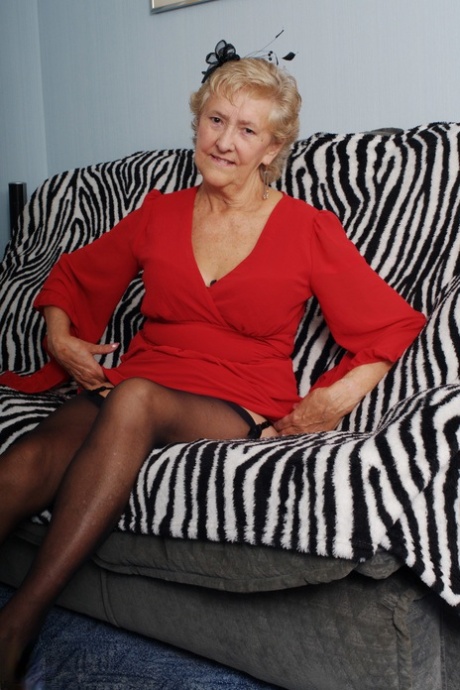 Old granny Ruth losing her red dress and exposing her saggy boobs in lingerie