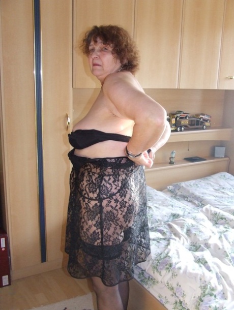 Fat granny Marlies strips and shows her saggy big tits before toying herself