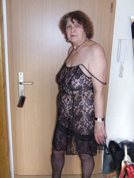Fat granny Marlies strips and shows her saggy big tits before toying herself
