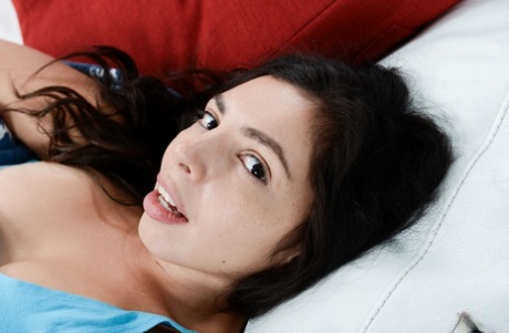 Small titted teen Luna Leve displays her huge bum and stretches her hole